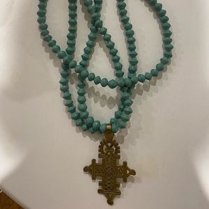 Turquoise and gold chunky cross necklace